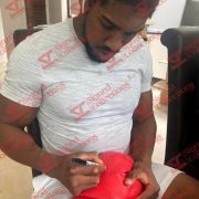 Anthony_joshua_signing_red_boxing_glove-transformed-1.jpeg